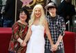 Christina con su madre y hermano